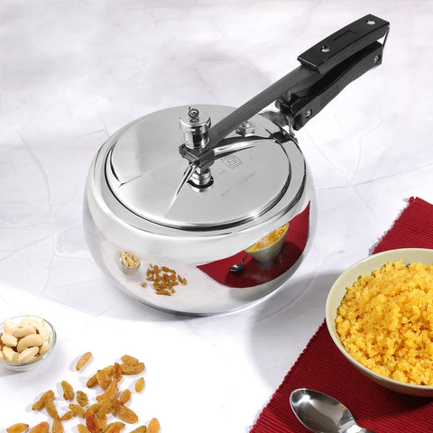 Vinod Europa Stainless Steel Handi Shape Inner Lid Pressure Cooker (Induction - Friendly) next to a bowl of sheera